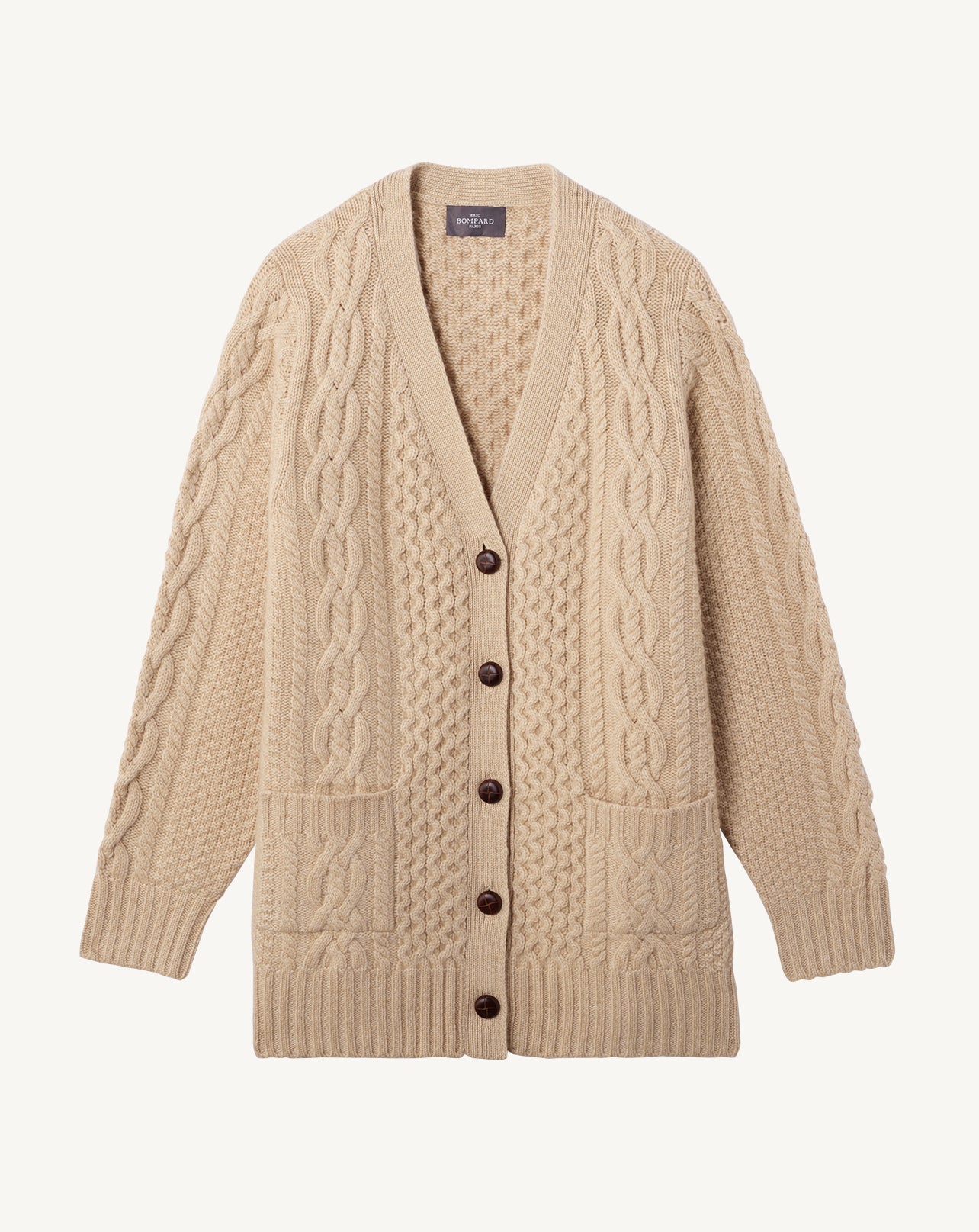 Cable knit loose cardigan with pockets and side slits in Cachemire