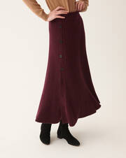 Ribbed flared long skirt with side button fastening