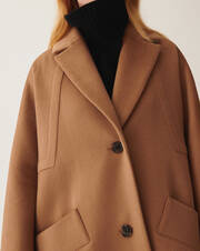 Double-sided oversized coat with geometric seaming