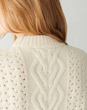 Puffball turtleneck pullover with cables and pointelle